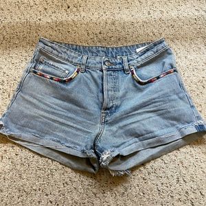 Embroidered frayed light wash denim shorts